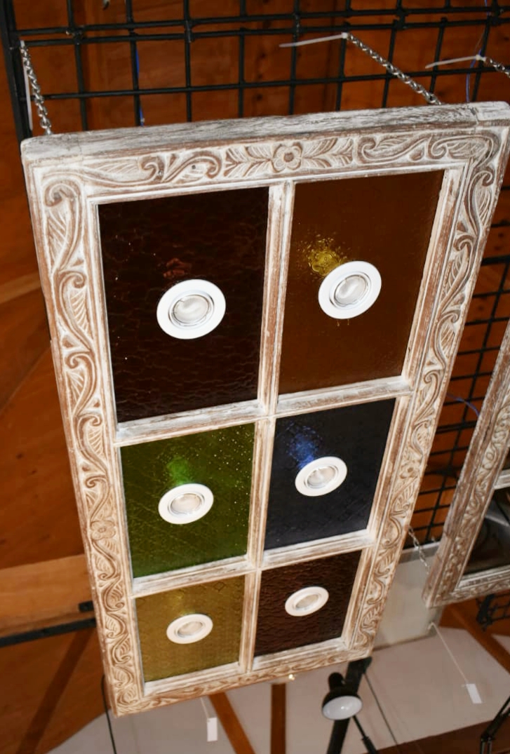 #C13 (Pic2)- Zanzibar window frame accented with coloured glass! This show stopper is perfect adorned over a bar or dining table KES 28000