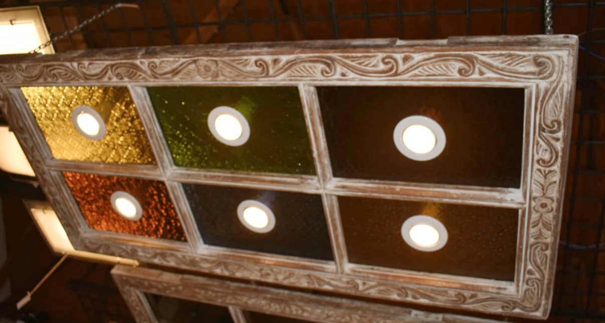 #C13 - Zanzibar window frame accented with coloured glass! This show stopper is perfect adorned over a bar or dining table KES 28000